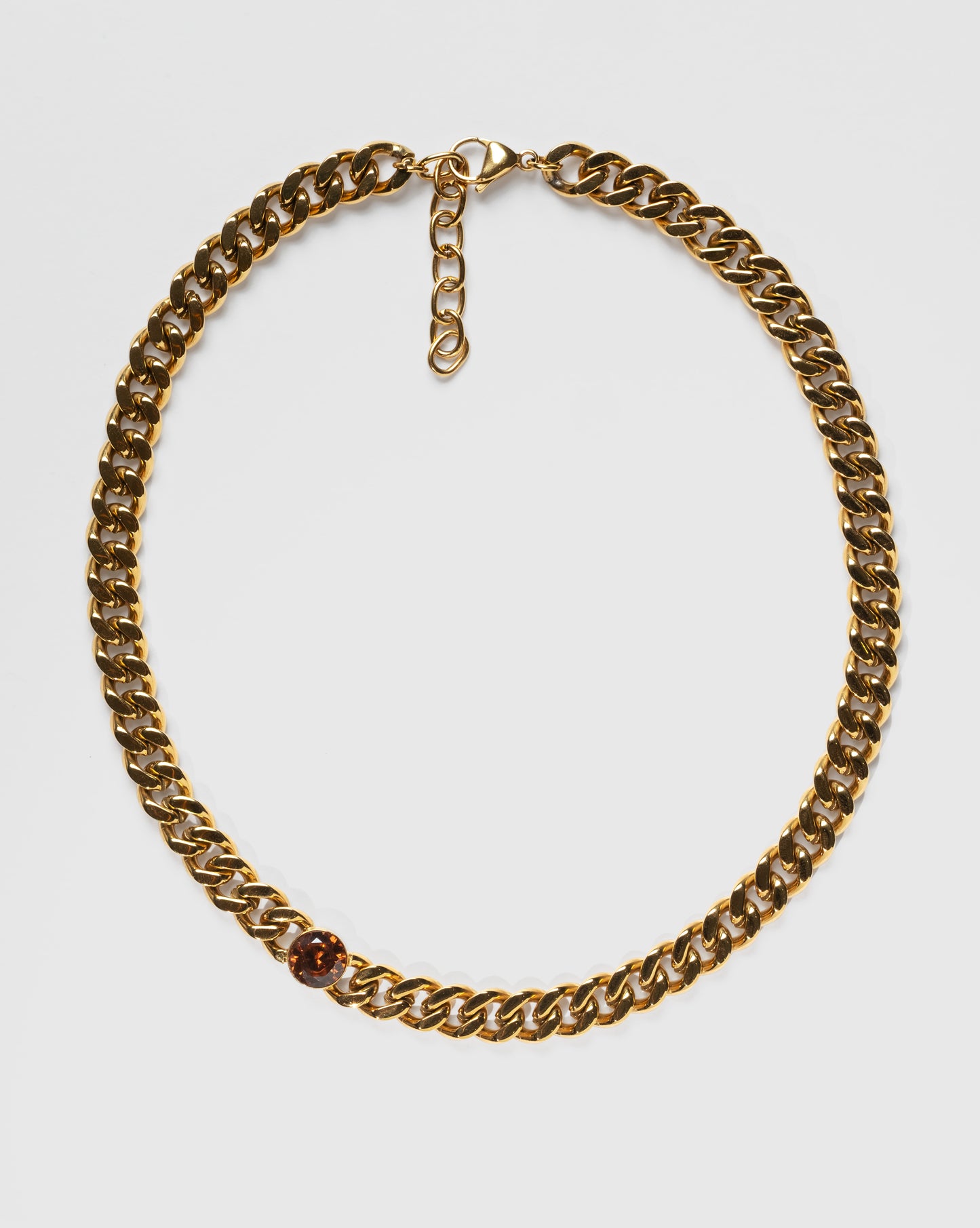 Guldfärgat kedjehalsband i rostfritt stål med bärnstensbrun cubic zirconia-sten